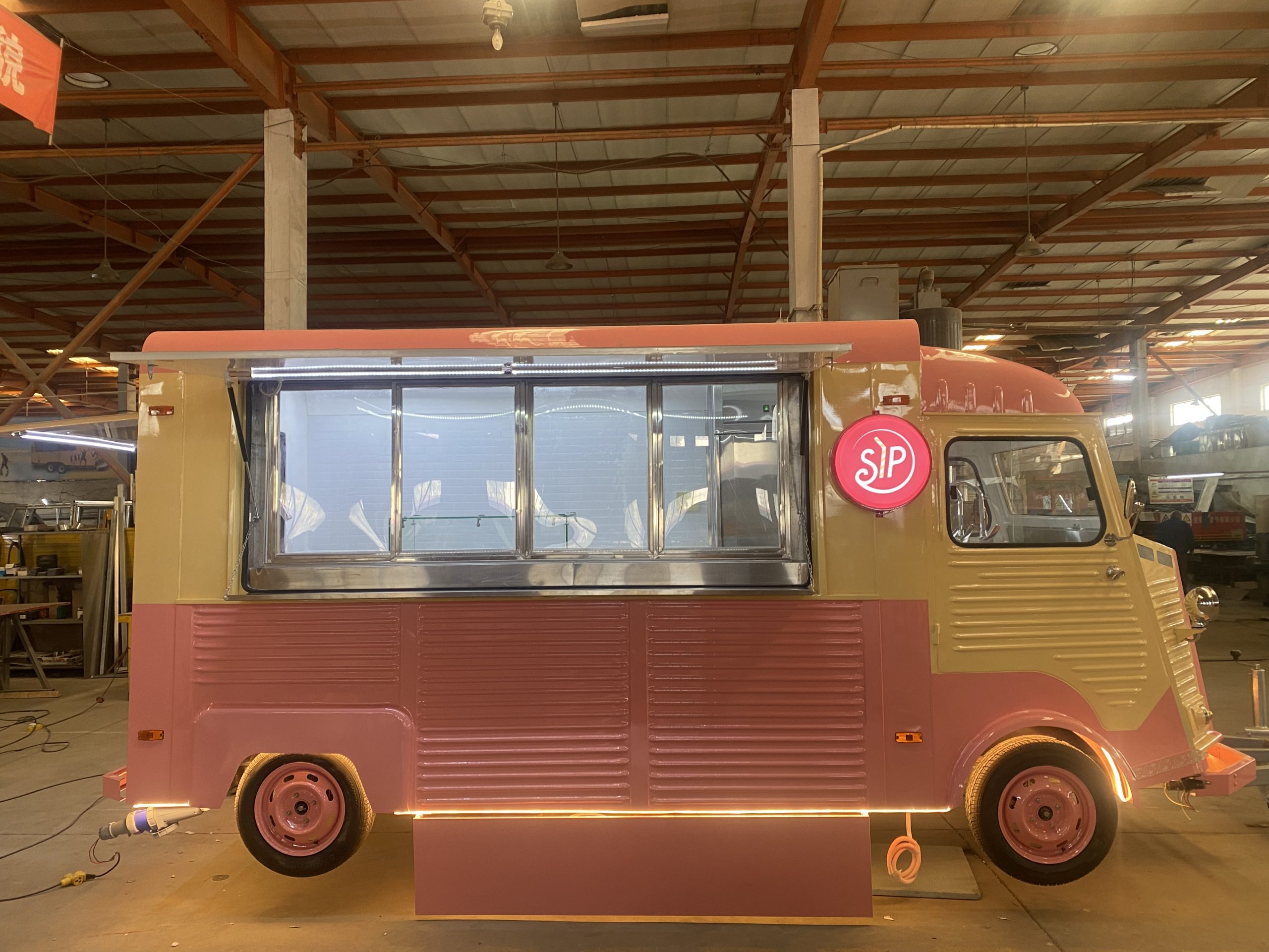 Retro Citroën HY coffee trailer with pink and cream exterior