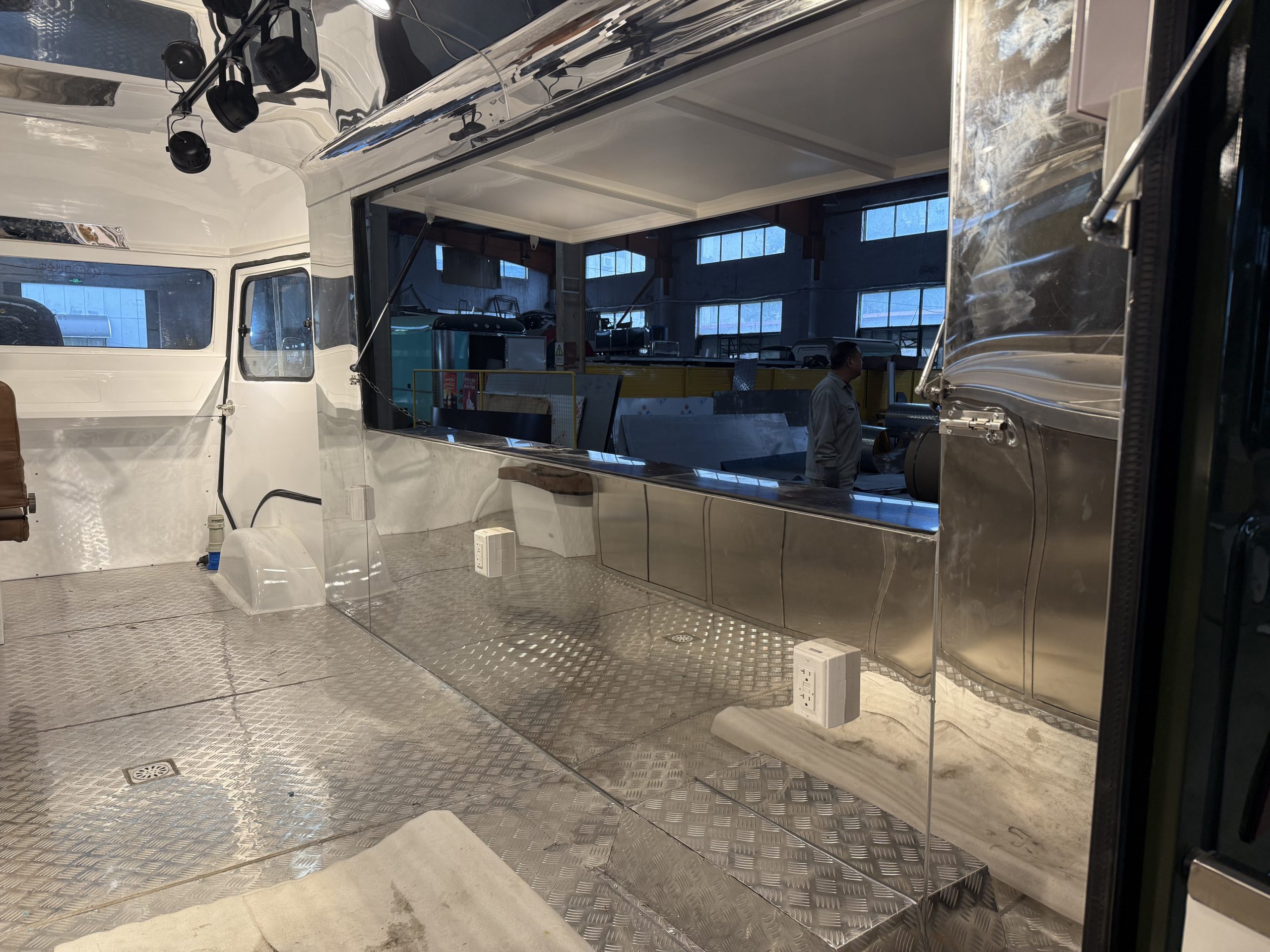 Interior space and large serving window inside retro food trailer