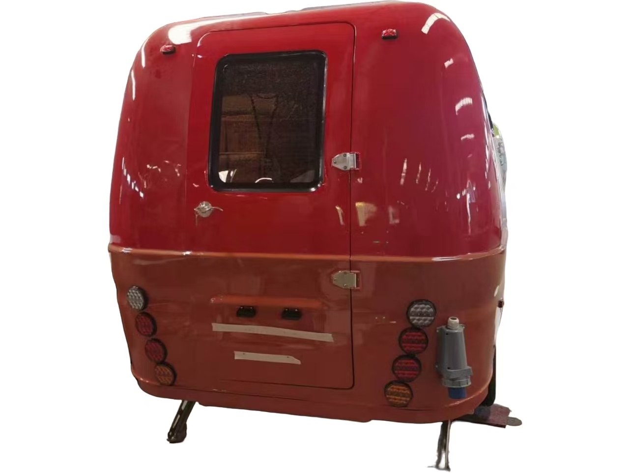 Rear entrance door of custom retro food trailer with compact catering layout