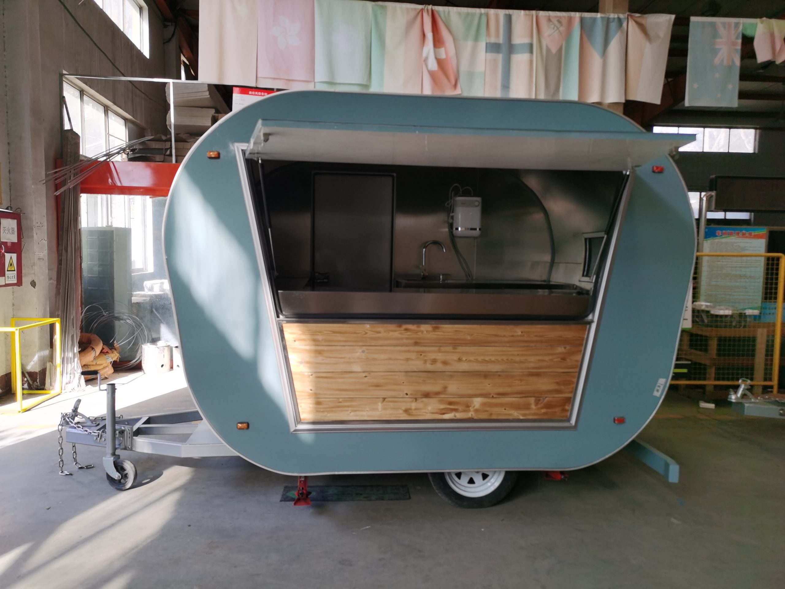 Custom Coffee Trailer serving window with wooden counter decoration