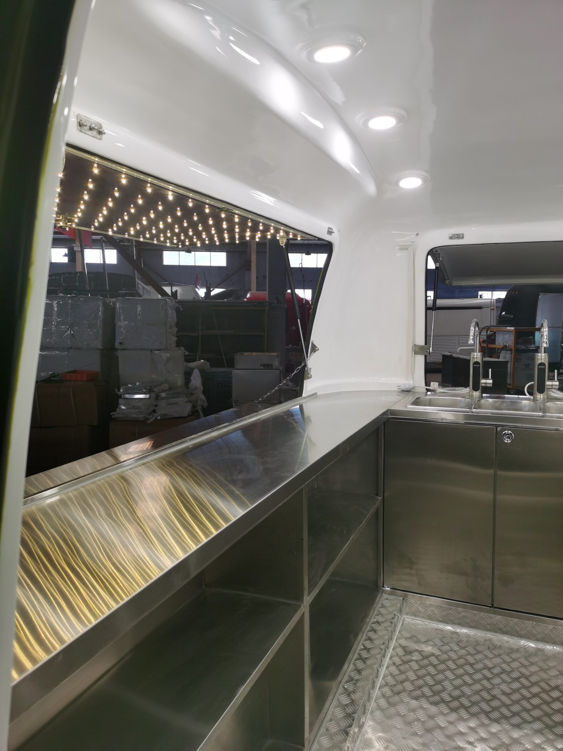 Interior view of 2.8M retro coffee trailer showing stainless steel worktops and LED ceiling lights