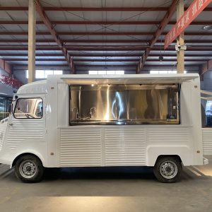 Vintage Citroën food truck with large serving window and stainless steel kitchen interior, 4.8m retro mobile catering vehicle.