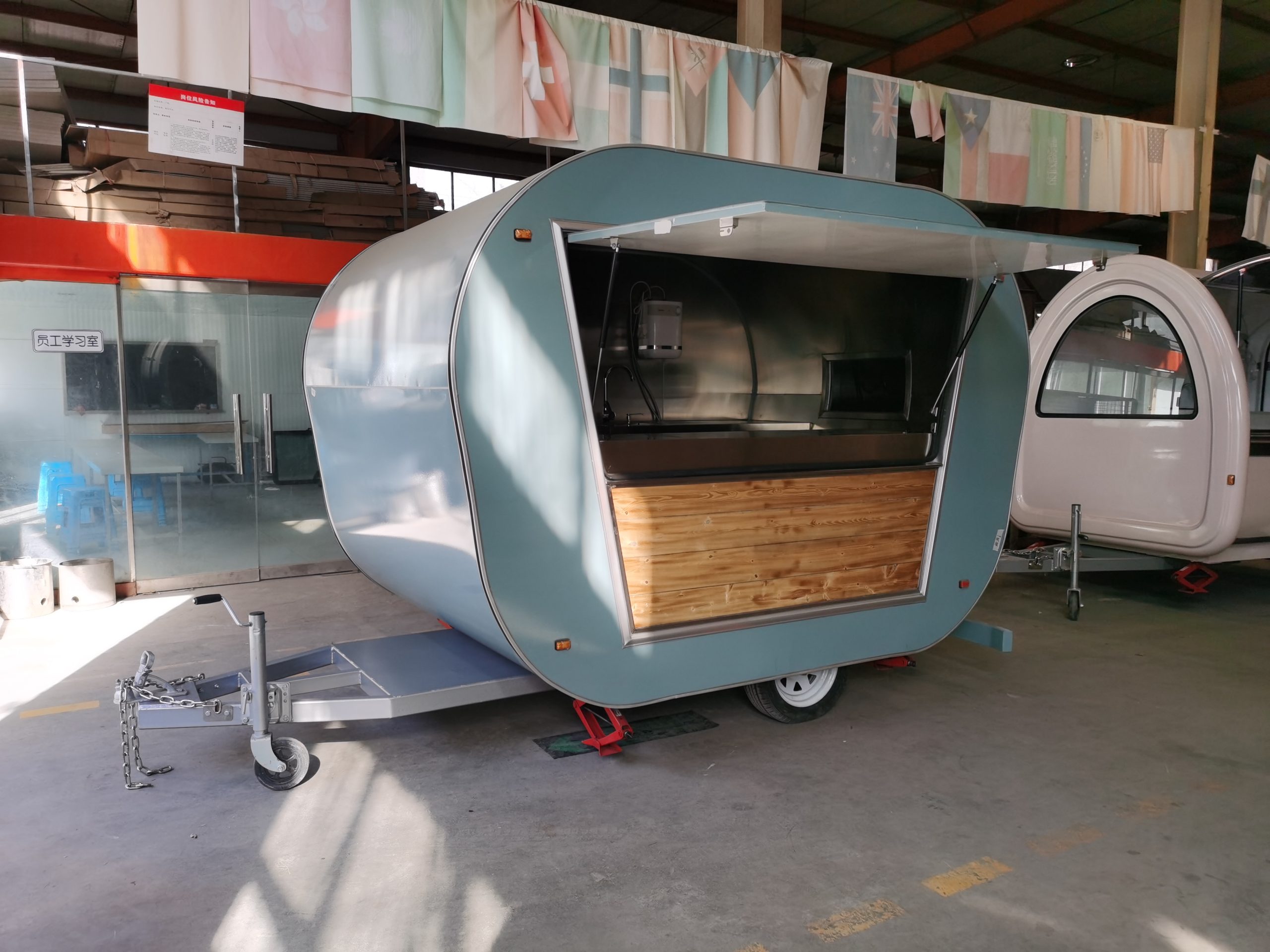 Custom Coffee Trailer front view with teardrop design and serving window