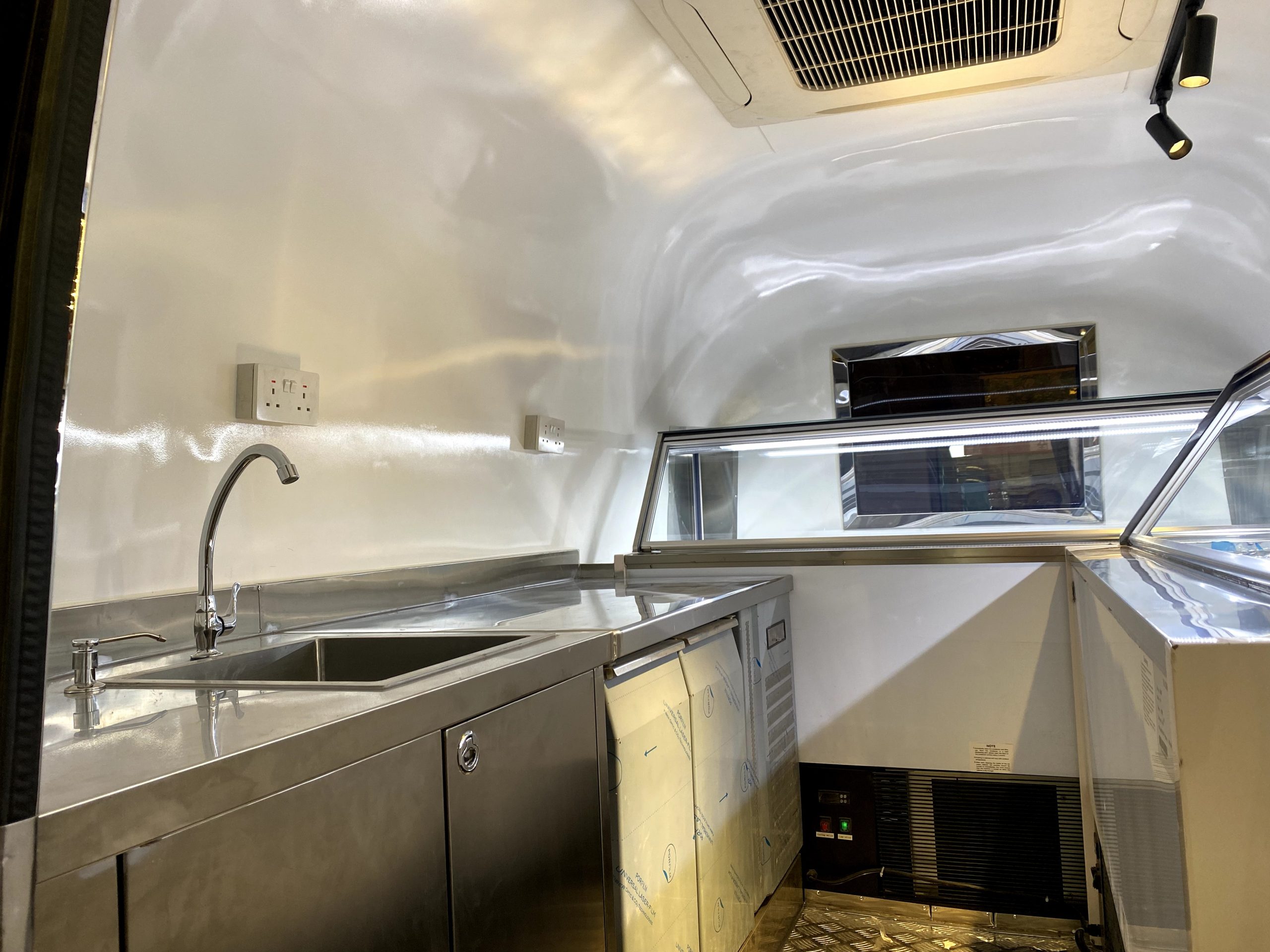 Food-grade stainless steel workspace inside custom ice cream trailer