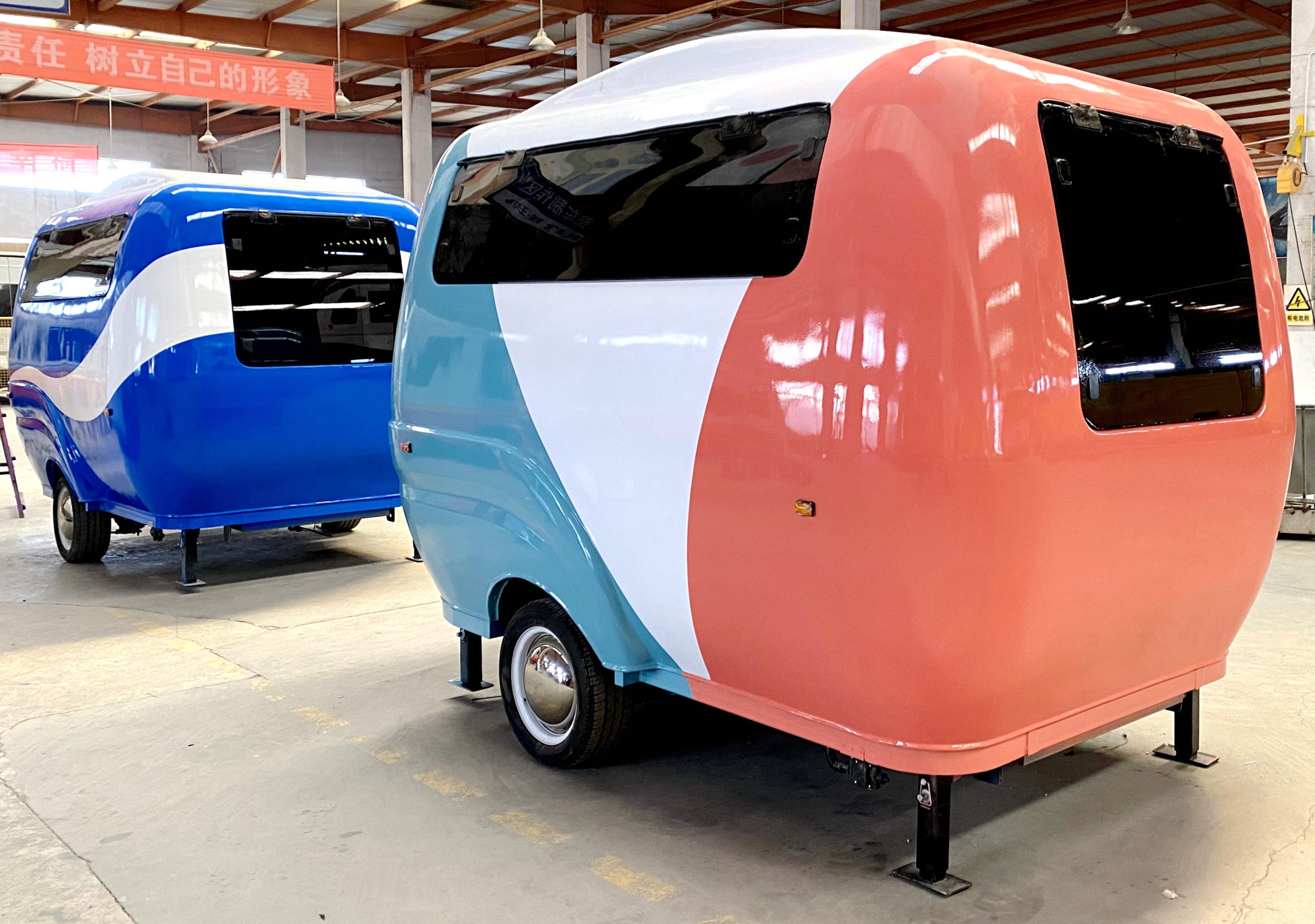 Custom BCF-10 retro food trailer with fiberglass body displayed in food trailer manufacturing workshop